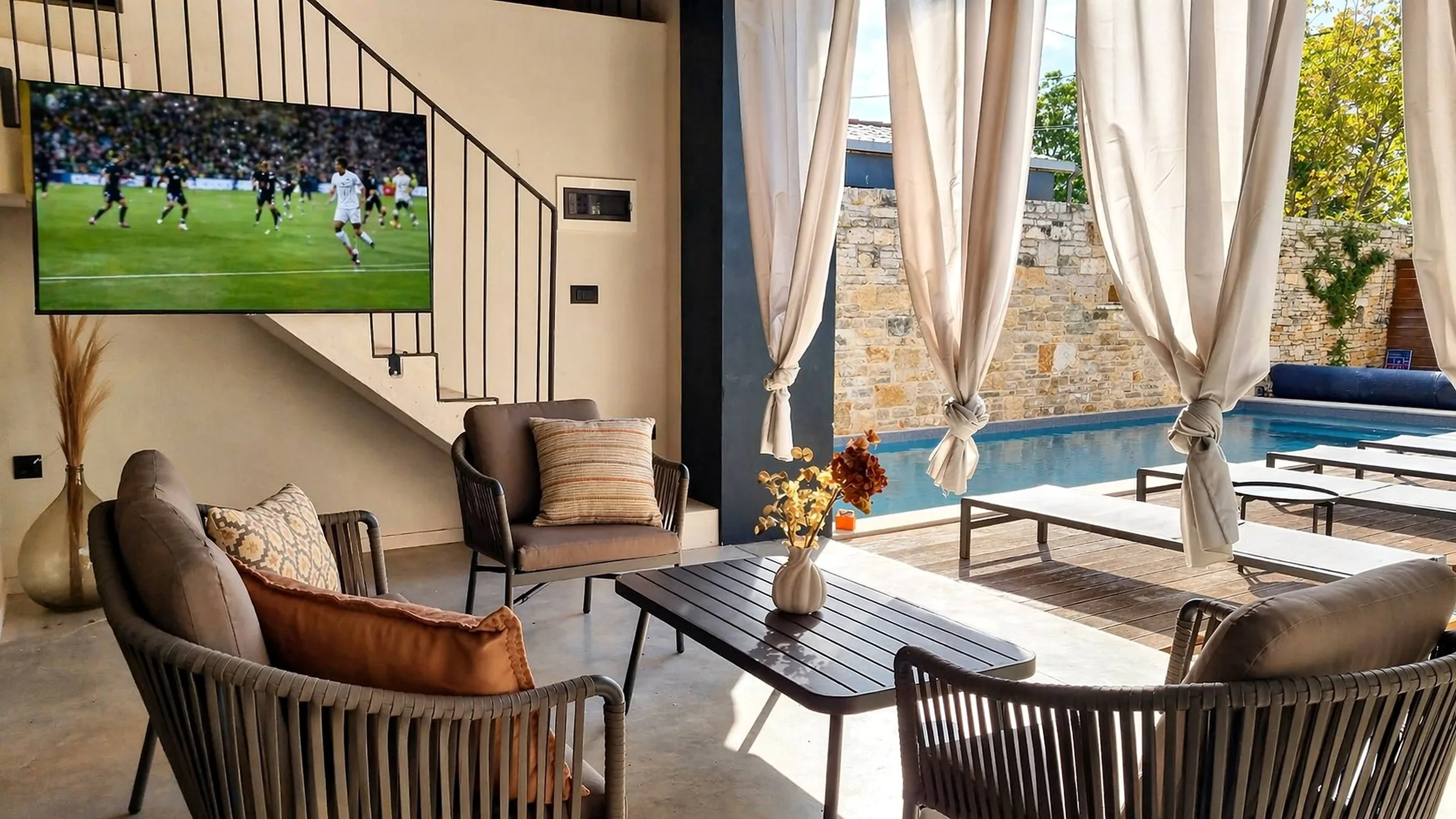 Villa Qualia — outdoor lounge and pool view